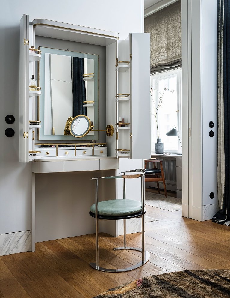 There's a gorgeous and functional makeup nook that can be hidden