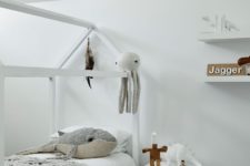 10 Another kid bedroom is also white, with a house-shaped bed and fun toys all around