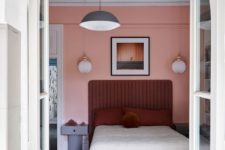 10 One more bedroom is filled with pink and burgundy and accented with mid-century modern touches