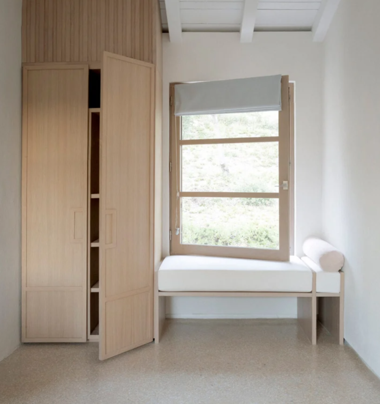 The storage units are simple and sleek, there's a cool window seat with shades, a perfect nook to read
