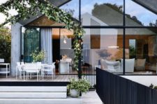 12 There’s a dining space outdoors surrounded with greenery