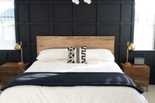 a black statement panel wall makes this neutral bedroom look bold, cool and unusual taking over the space