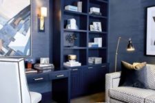 a bright home office done in bold blue, with elegant gold touches and some whites to refresh the space