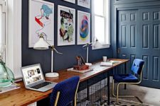 a stylish home office with nice blue walls