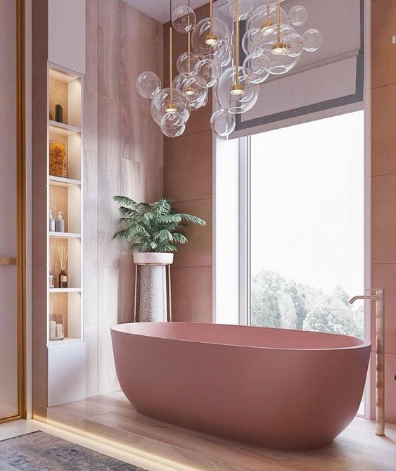 A cool bathroom with pink plywood walls, a pink tub, lit up built in shelves and lots of bubble lights over the bathtub