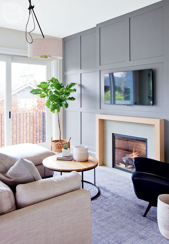 a grey wall won't be boring if you go for some paneling like here and maybe build in a fireplace for a chic look