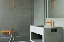 a minimalist concrete bathroom with bold orange fixtures and a mirror plus glass walls is a stylish and elegant idea