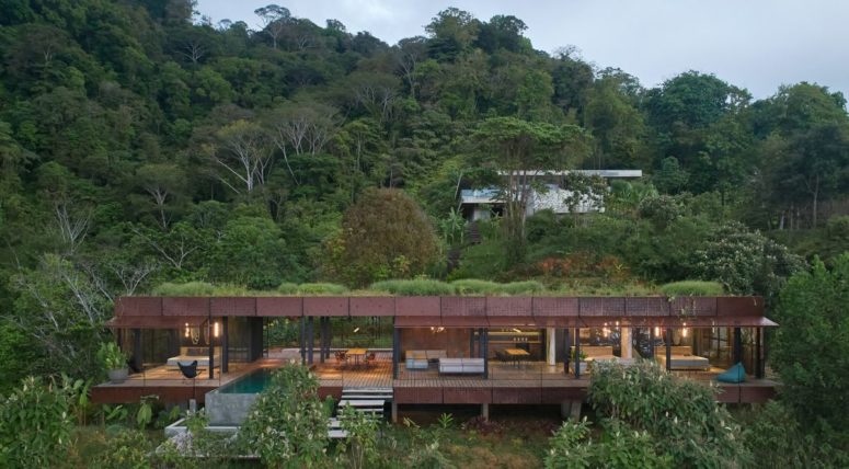 This jungle villa features an industrail facade and luxurious interiors plus cool natural views