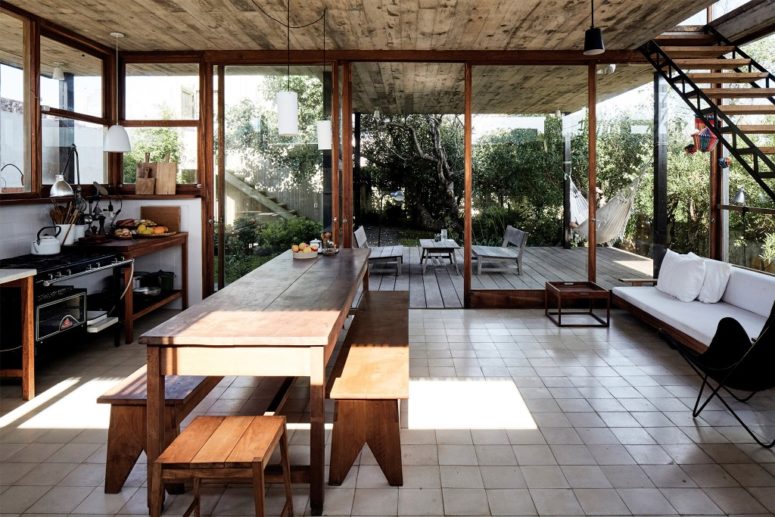 The kitchen is fully glazed and feels indoor-outdoor thanks to its design and not much furniture