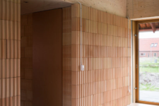 06 Terracotta, plywood, wood and concrete are used for inner and outer decor of the house and such a combo looks unusual