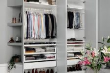 06 a stylish small built-in closet with shelves up and down and some holders for clothes hangers is a perfect idea
