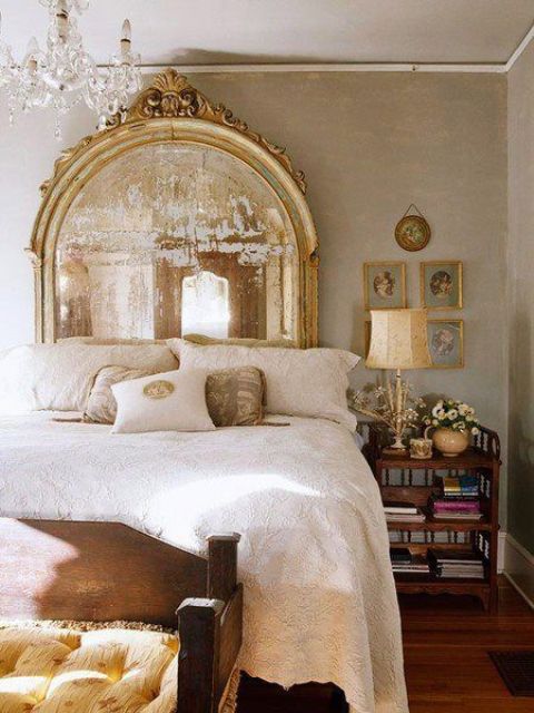 A vintage statement mirror in a refined gold frame will add an exquisite feel and a chic touch to your bedroom