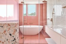 07 The bathroom also features lots of pink, neutral tiles and terrazzo