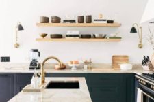 09 a black wooden kitchen highlighted with earthy-colored marble countertops including a waterfall one that make a real statement