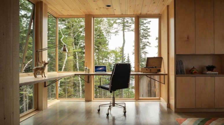 This modern floating desk takes full advantage of the floor-to-ceiling windows and the abundance of natural light