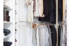 10 a small contemporary closet with holders for hangers, open shelves for various stuff, a basket and a large mirror