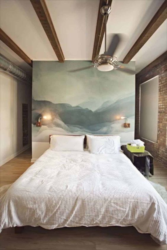 an abstract statement artwork instead of a usual headboard is a cool and chic idea that will an artsy touch to the space