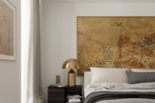 13 a chic and stylish bedroom with a statement artwork and bold brass lamps that add chic and a cool look to the space