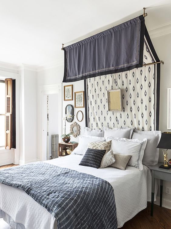 a canopy attached to the wall and ceiling and an artwork will make your bedroom refined and vintage-inspired