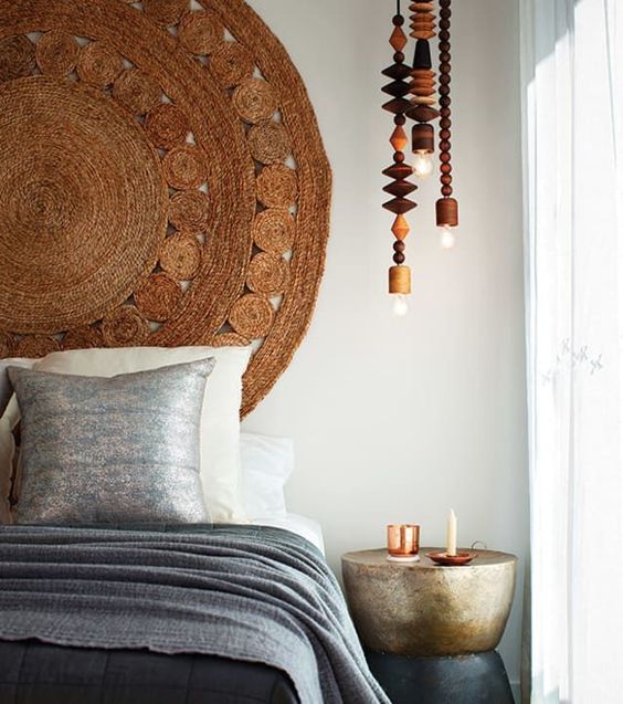 a new oversized jute rug like this one can be used as a headboard for a nature-inspired or Asian-inspired space