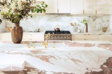 19 a sleek plywood kitchen with a pink marble backsplash and a gorgeous pink marble kitchen island that wows