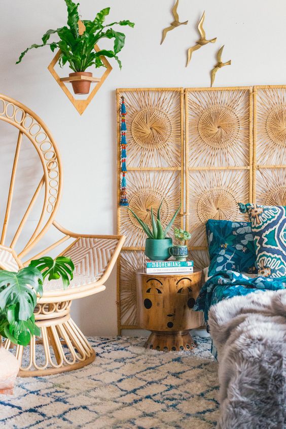 a woven screen instead of a headboard and a peacock chair will make your bedroom feel trendy and boho