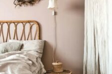 a beautiful Scandinavian bedroom with blush walls, textural textiles and rattan furniture is very relaxing and soothing