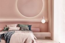 a chic modern bedroom with pink walls and a ceiling, with a round lit up mirror, a bulb, muted color bedding and a pink round rug