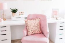a glam home office with pink tropical artworks, a pink chair with a sequin pillow and other touches of pink