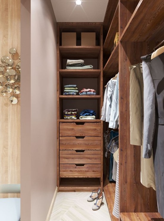 A rich stained narrow closet with open shelves and drawers, some lights over the space is a well organized and cool space