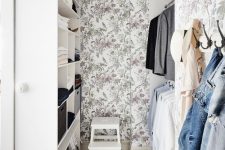 a lovely closet with a botanical wallpaper
