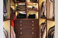 a small closet with open shelves and built-in lights, drawers for storage is a clever and cool solution for your home