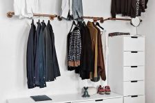 a small makeshift closet with rails with hangers and dressers will easily fit any bedroom and make most of your space