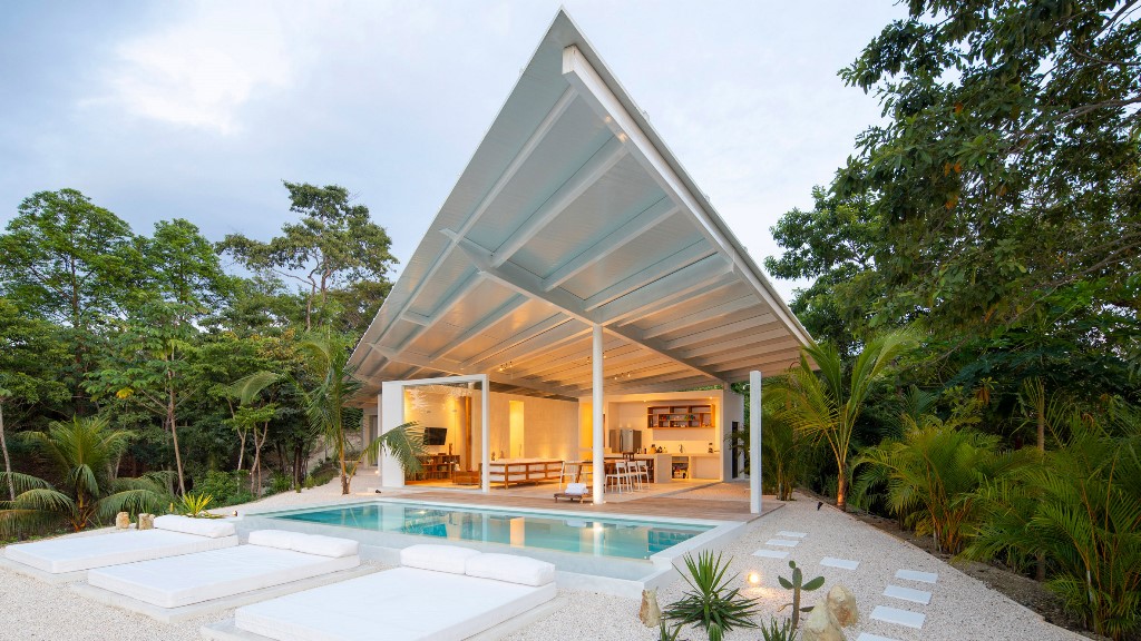 This contemporary villa is built in a remote part of Costa Rica and features all white and an angular roof