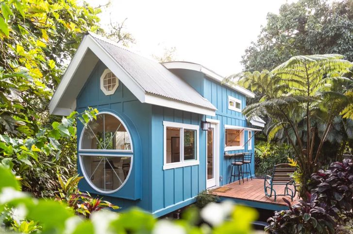 This lovely blue home is just 260 square feet and it features cool decor and much character