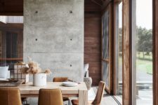 02 There’s much natural wood in various stains in decor and it’s complemented with concrete and leather for an ultra-modern look