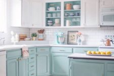 03 a two-tone kitchen with white uppers and light blue lowers plus gold hardware looks cool