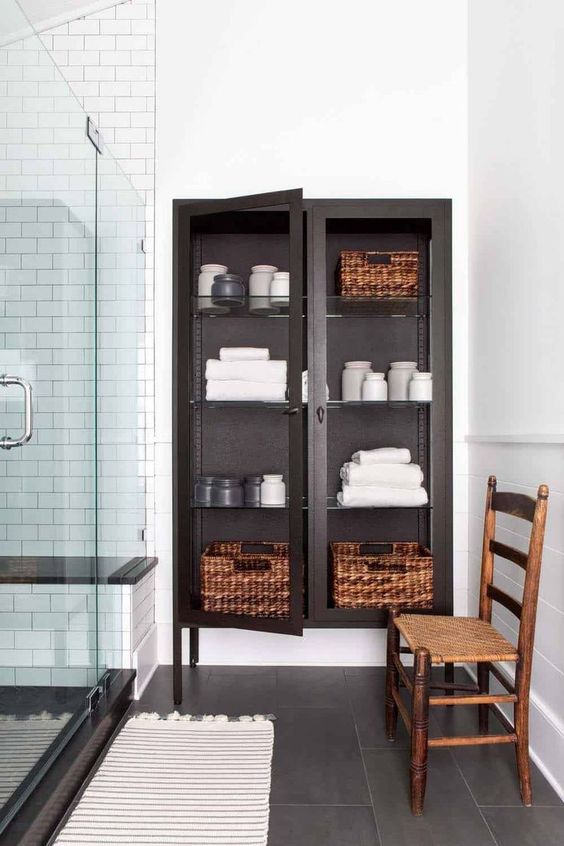 a glass closet with towels is a nice towel storage piece but it fits only a large bathroom