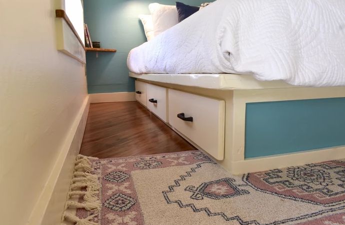 The bed features some storage drawers