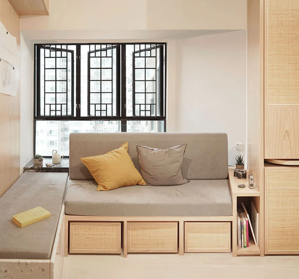 The sofa for the living room is custom-made, with rattan drawers for storage below