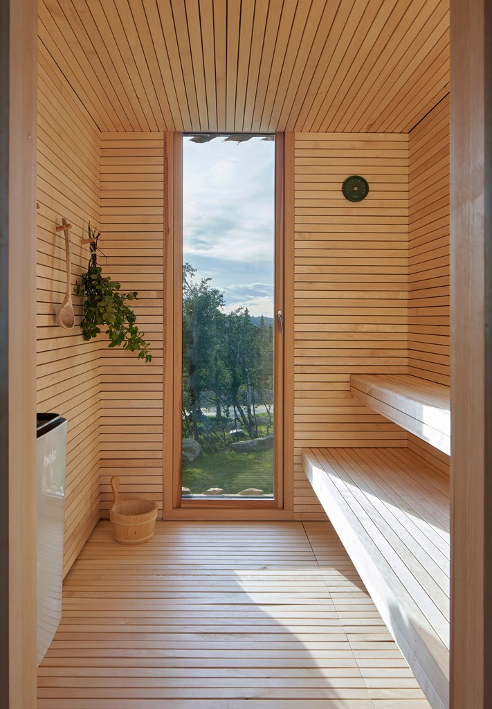 There's a sauna that features a glazed entrance to enjoy the views while staying here