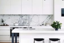 06 a chic white minimalist kitchen with touches of black for more drama and a white marble backsplash for a refined feel