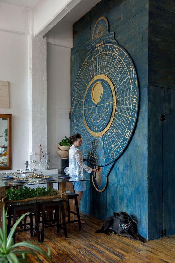 A gorgeous oversized moon calendar themed wall art in blue and gold is a bold statement