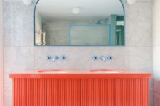 08 There’s a red vanity and touches of blue – frames, fixtures and other details