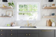 08 a graphite grey kitchen with a white marble wall and countertops plus touches of gold for more chic