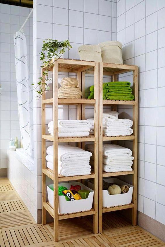 Molger shelves by IKEA used for storing towels, baskets with soaps and foams, kids' toys and other stuff