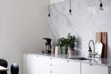 10 a modern white kitchen with a white marble tile backsplasj and countertops looks chic, elegant and stylish