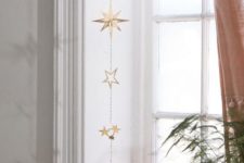 13 a beautiful gold star wall hanging or window hanging will bring a slight celestial touch to your space
