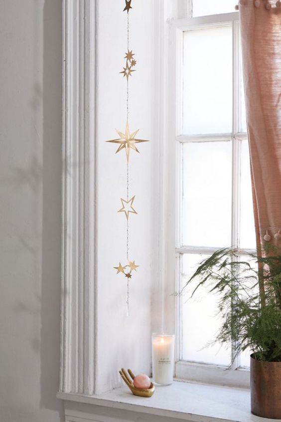 a beautiful gold star wall hanging or window hanging will bring a slight celestial touch to your space