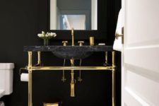 15 a chic dark powder room accented with a black marble sink on a gold stand looks very exquisite and stylish